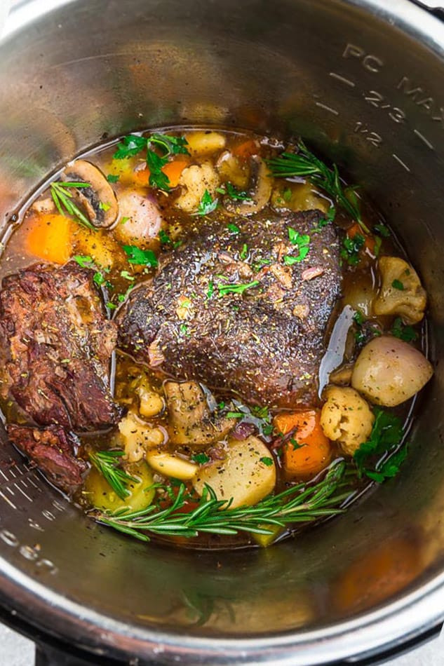 The Bowl of an Instant Pot Containing Beef and Vegetables