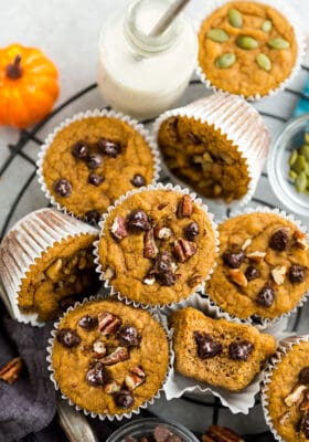 Top view of keto pumpkin muffins on a round wire rack on a grey background