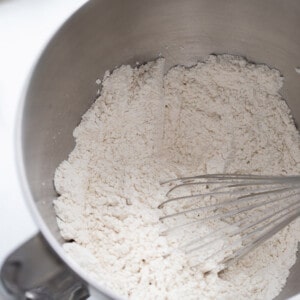 Top view of gluten-free flour and yeast in a stand mixer bowl