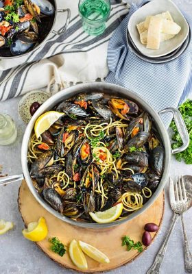 Steamed Mediterranean PEI Mussels are the perfect easy 30 minute meal or appetizer. Best of all, a simple & elegant dish for entertaining.