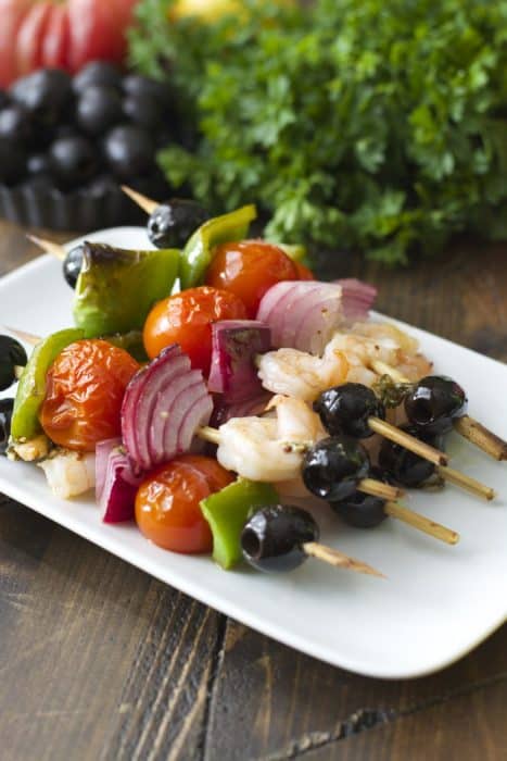 Mediterranean kebabs with grilled shrimp and vegetables on a plate