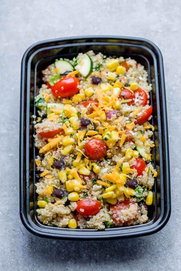 Mexican Quinoa Salad with delicious grilled corn and zucchini make the perfect summery meal. Best of all, it's so easy to customize and is loaded with cucumbers, black beans, cherry tomatoes,, red onions and optional shredded cheese and then tossed in a sweet and tangy honey lime vinaigrette.