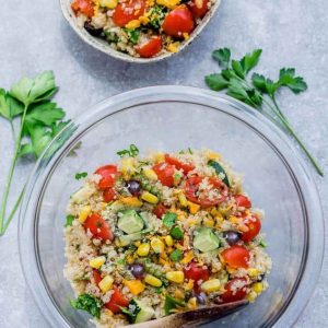 Top view of Mexican Quinoa Salad in a mixing bowl and in a smaller bowl