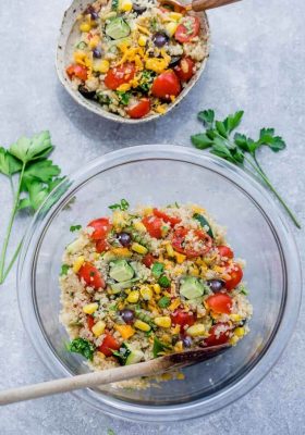 Mexican Quinoa Salad with delicious grilled corn and zucchini make the perfect summery meal. Best of all, it's so easy to customize and is loaded with cucumbers, black beans, cherry tomatoes,, red onions and optional shredded cheese and then tossed in a sweet and tangy honey lime vinaigrette.