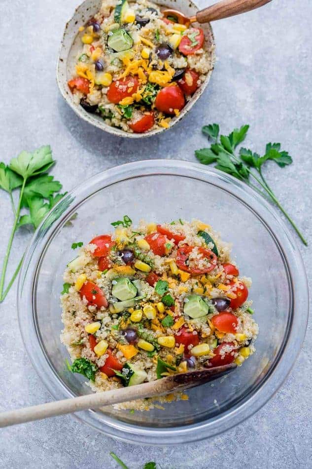 Top view of Mexican Quinoa Salad in a mixing bowl and in a smaller bowl