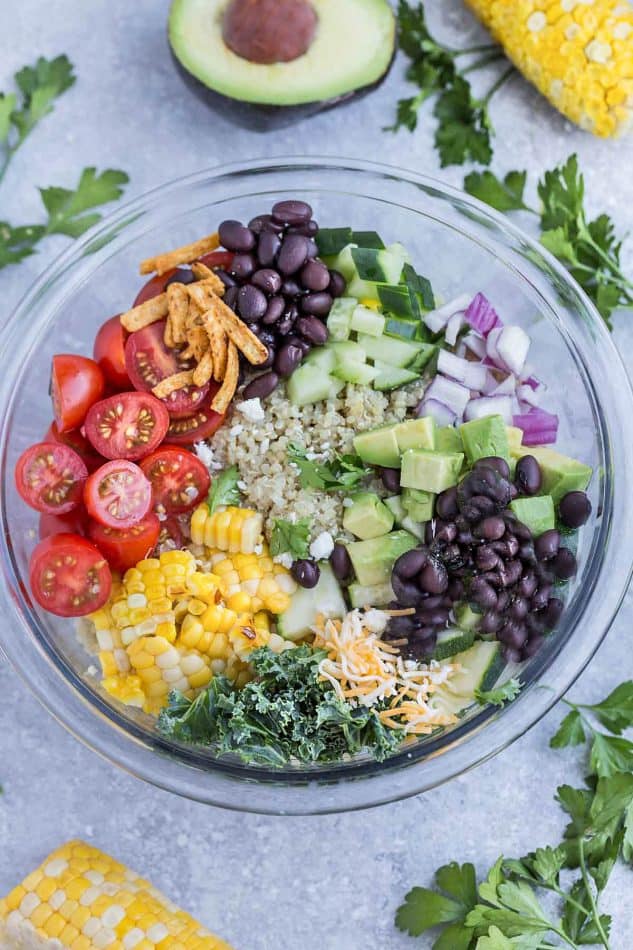 Top view of colorful Mexican Quinoa salad ingredients in a mixing bowl