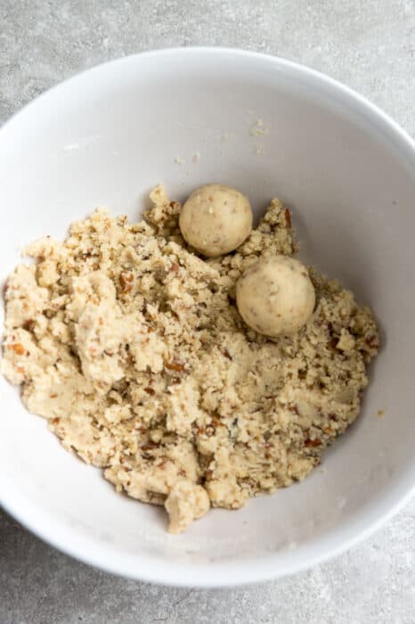 Top view of cookie dough in a white mixing bowl