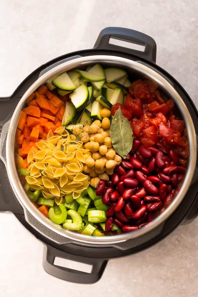 Top view of ingredients in an Instant Pot to make Homemade Minestrone Soup 