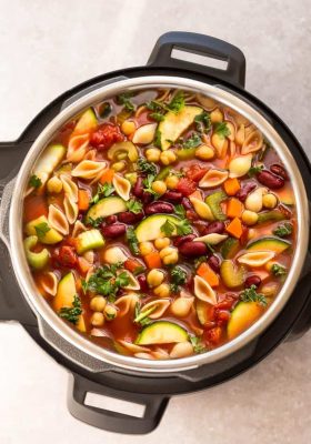 Instant Pot Minestrone Soup makes the perfect homemade easy comforting meal. Best of all, it's an easy set and forget recipe and is so much healthier and better than Olive Garden's version! Made entirely in your pressure cooker and is SO delicious!
