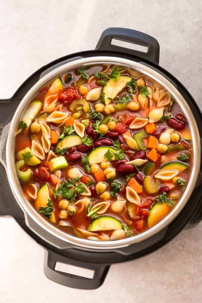 Instant Pot Homemade Minestrone Soup makes the perfect easy comforting meal. Best of all, it's an easy set and forget recipe and is so much healthier and better than Olive Garden's version! Made entirely in your pressure cooker and is SO delicious!
