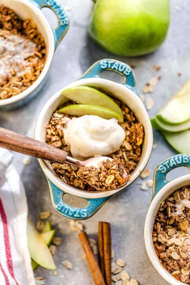 This recipe for Apple Crisp is the perfect easy treat for fall. Best of all, these delicious mini crisps are gluten free, butter free and refined sugar free. Made with fresh apples, and the crispiest oat crumble topping. Serve it bubbling hot with some creamy vanilla frozen yogurt or vanilla ice cream for the ultimate dessert.