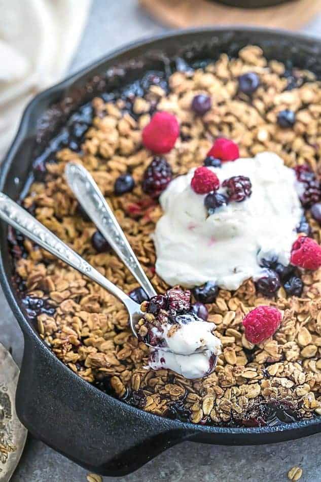 This delicious Mixed Berry Skillet Crisp is the perfect easy dessert to use up any summer or frozen berries. Best of all, there's only 10 minutes of prep time and is loaded with strawberries, blueberries, blackberries and raspberries. Plus, it's healthier than most crisps and crumbles since it's gluten-free, vegan and refined sugar free.