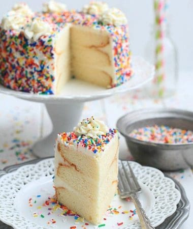 My favorite Vanilla Birthday Cake with Vanilla Bean Frosting - A light, fluffy and delicious frosted vanilla cake with sprinkles – perfect for a birthday or any celebration! by @LifeMadeSweeter