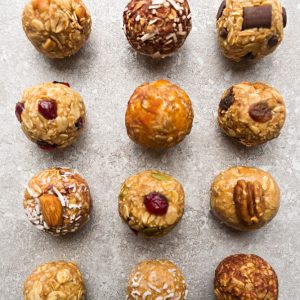 No Bake Energy Bites 12 Different Ways - the perfect easy and healthy no bake & tasty gluten free snacks for on the go or after a workout! Best of all, most of these delicious recipes have no refined sugar and are simple to customize & make ahead for meal prep to pack for school or work lunchboxes. Flavors include: 5 Ingredient, Almond Joy, Apple Cinnamon, Apricot, Banana, Carrot Cake, Coconut Almond Butter, Cranberry, Lemon, Mocha, Oatmeal Raisin, Pumpkin & Turtle Pecan