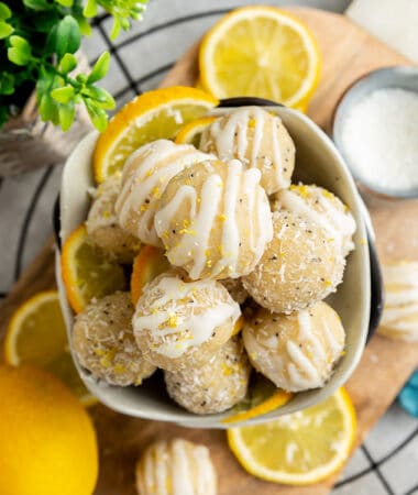 Top view of a pile of No Bake Vegan Lemon Protein Balls stacked in a white bowl