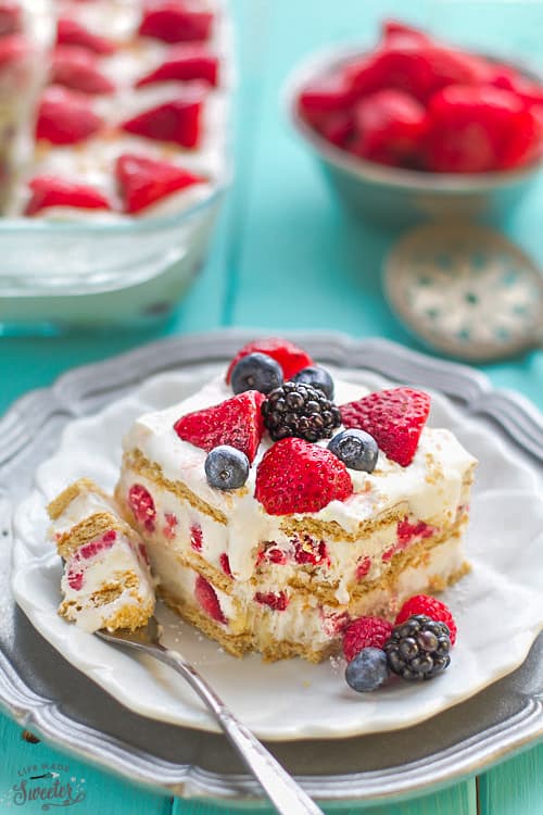 A square of Berry Cheesecake icebox cake on a plate with a fork