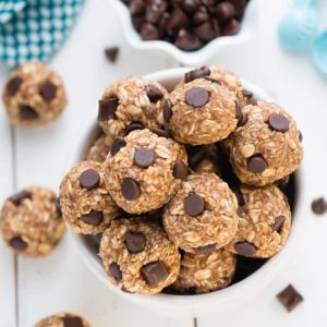 Top view of a pile of peanut butter energy bites in a white bowl