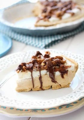 One slice of peanut butter pie on a white plate