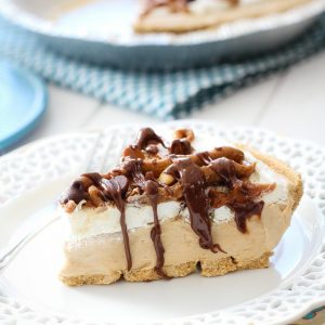 One slice of peanut butter pie on a white plate