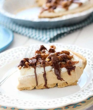 One slice of peanut butter pie on a white plate