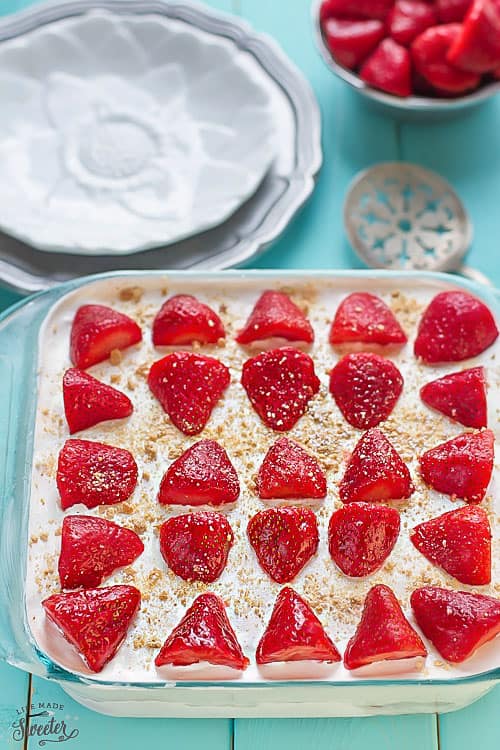 Top view of a square glass pan of No Bake Strawberry Cheesecake Icebox Cake