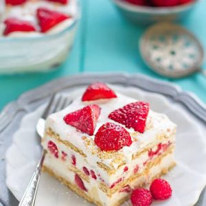 A square of No Bake Strawberry Cheesecake Icebox Cake on a plate with a fork