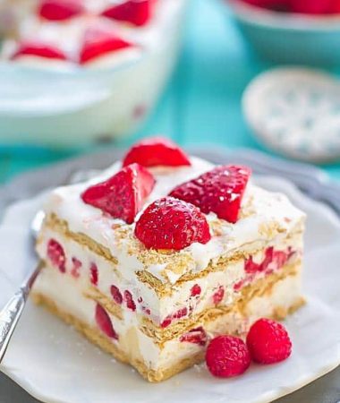 A square of No Bake Strawberry Cheesecake Icebox Cake on a plate with a fork