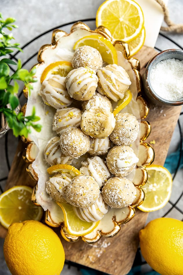 Top view of a pile of No Bake Vegan Lemon Protein Balls stacked in an oval white bowl