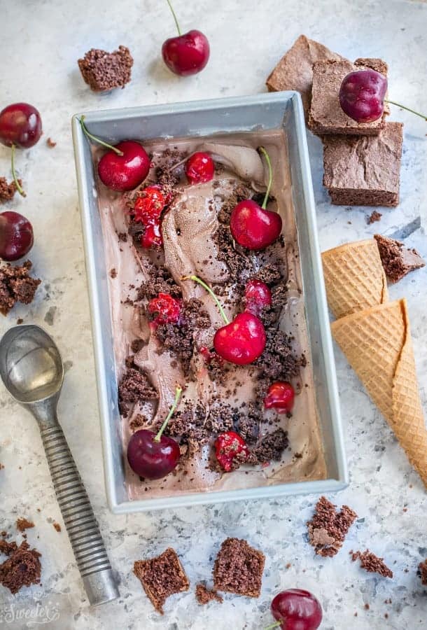 Top view of No Churn Black Forest Ice Cream topped with cherries in a rectangular pan