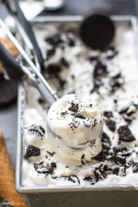 No Churn Oreo Ice Cream in a loaf pan with a scoop