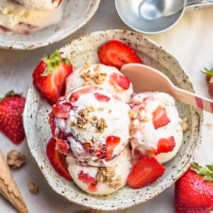 No Churn Strawberry Cheesecake Ice Cream is the perfect frozen sweet treat for summer. Best of all, super simple to make and no ice cream maker needed! Full of delicious fresh strawberries, cream cheese and crunchy granola streusel clusters.