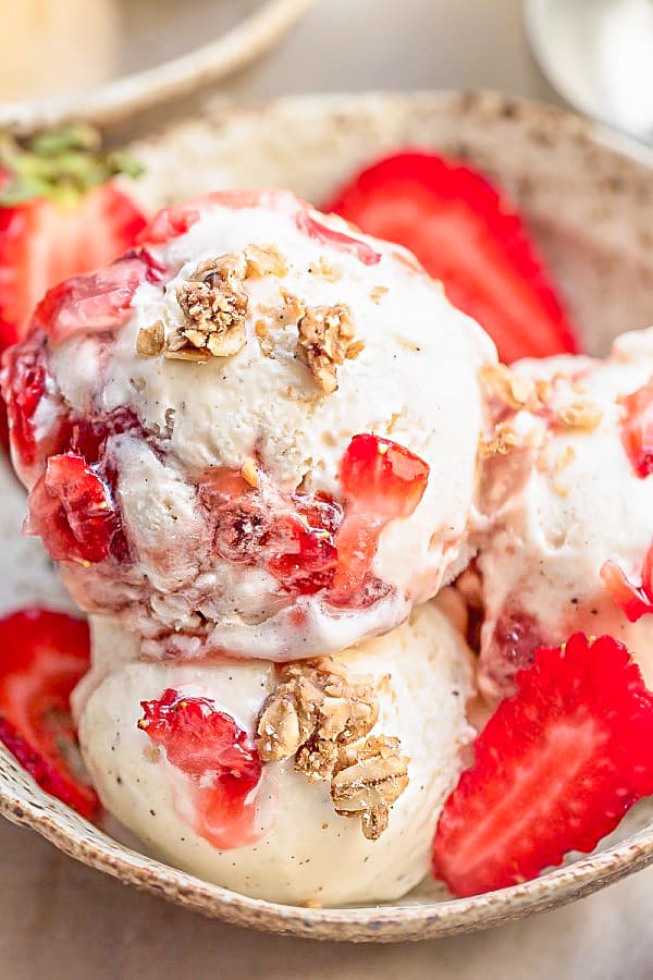 No Churn Strawberry Cheesecake Ice Cream is the perfect frozen sweet treat for summer. Best of all, super simple to make and no ice cream maker needed! Full of delicious fresh strawberries, cream cheese and crunchy granola streusel clusters. 