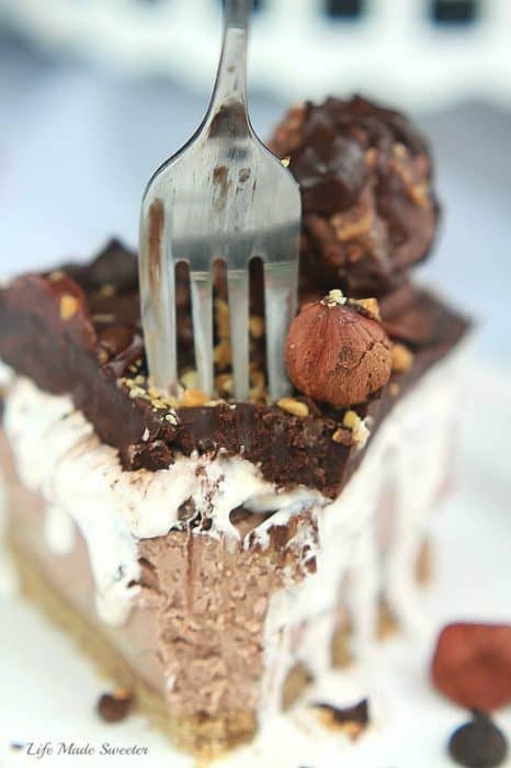 A slice of Nutella No-Churn Banana Ice Cream Cake with a fork in it
