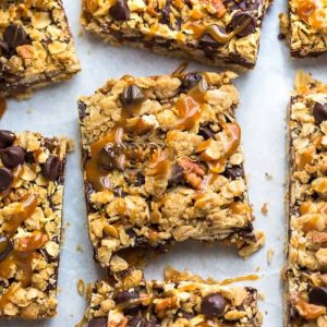 Oatmeal Carmelitas make the perfect easy decadent treat. Best of all, they're soft, chewy and full of delicious layers of oatmeal, chocolate and gooey caramel. Great for bringing along to dessert bars or any potluck or parties.