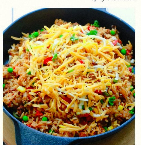 One Pan Mexican Rice Skillet makes the perfect easy 30 minute weeknight meal! Best of all, so simple to customize and everything cooks all in ONE pot - even the rice! Leftovers would be so delicious for school lunchboxes or work lunch bowls and you can even use this recipe for Sunday meal prep!