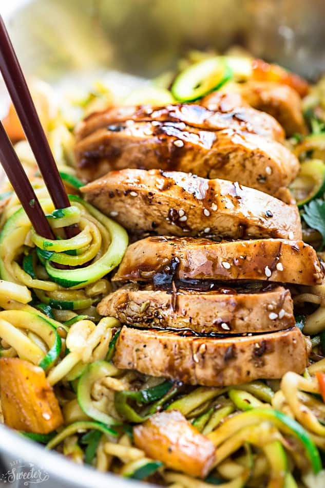 Close-up view of Teriyaki Chicken Zoodles with chopsticks
