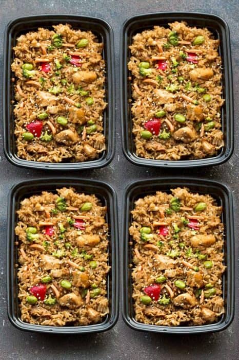 Top view of four meal prep containers of Teriyaki Rice with Chicken and Vegetables