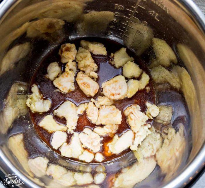 Top view of chicken pieces with teriyaki sauce in an instant pot