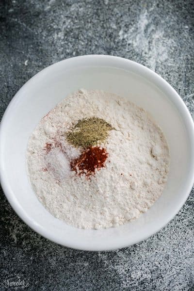 A Bowl Filled with Flour and Spices on a Counter Top