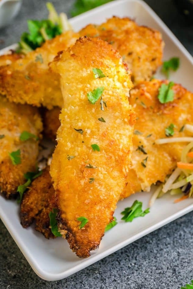 plate of golden crispy oven baked fried chicken tenders