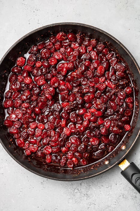 Overhead view of fresh cranberry sauce cooking in a skillet
