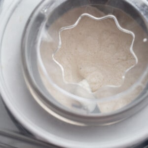 Top view of blended dairy-free vanilla ice cream in an ice cream maker