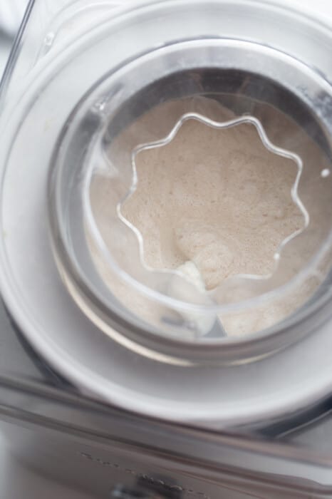 Top view of blended dairy-free vanilla ice cream in an ice cream maker