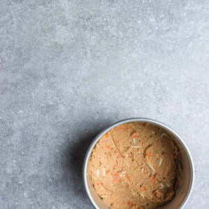 Carrot cake batter in a round cake pan