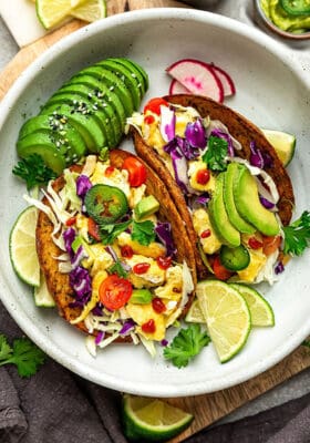 Overhead image of breakfast tacos with avocado,