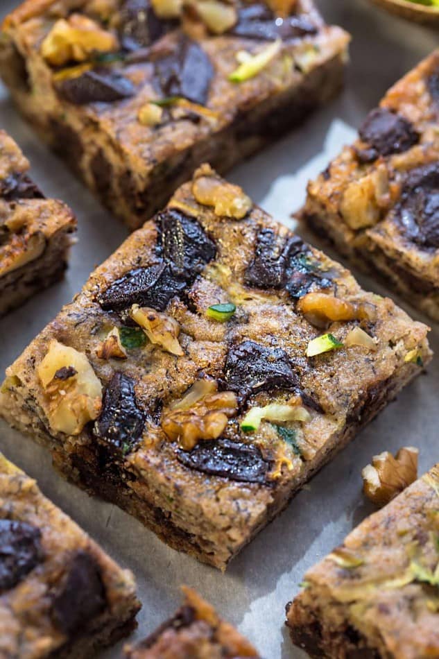 Paleo Pumpkin Zucchini Bars with Chocolate Chunks make the perfect healthy gluten free snack. Best of all, they're refined sugar free and will still satisfy that sweet tooth craving!