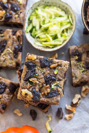 Paleo Pumpkin Zucchini Bars with Chocolate Chunks make the perfect healthy gluten free snack. Best of all, they're refined sugar free and will still satisfy that sweet tooth craving!