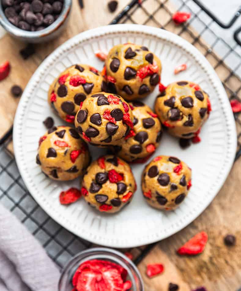 Overhead view of Strawberry Protein Balls with chocolate chips on a plate