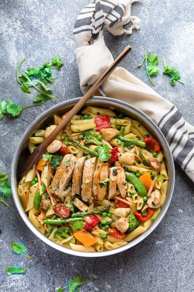 Top view of pasta primavera with chicken in a skillet