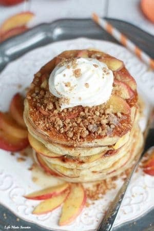 Peach Cobbler Pancakes - extra fluffy pancakes filled with juicy peaches topped with a warm spiced streusel is like having a yummy peach cobbler for breakfast